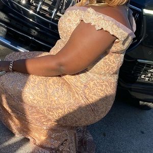 This is a rose gold custom made mermaid fitted prom dress.